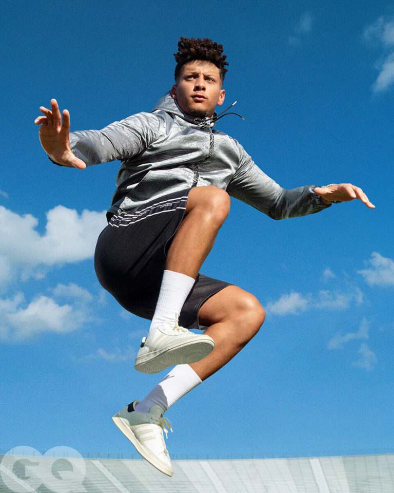 1UP Sports Marketing client Patrick Mahomes springs in the air wearing shorts and adidas sneakers for a GQ photoshoot