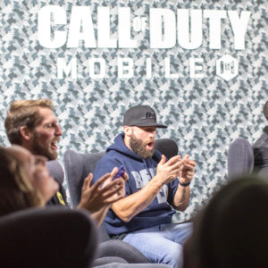 1UP Sports Marketing client Julian Edelman playing on his phone at the launch of Call of Duty: Mobile