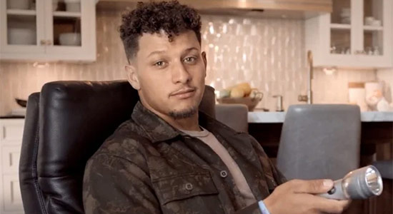 1UP Sports Marketing client Patrick Mahomes holds a flashlight as part of Coors Light Flashlight ad campaign