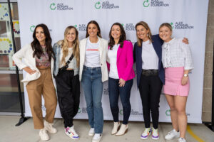 1UP Sports Marketing client Alex Morgan posing with VIPs at her Alex Morgan Foundation launch event