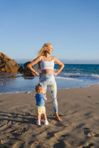 1UP Sports Marketing client Brittany Mahomes on the beach with her daughter Skye