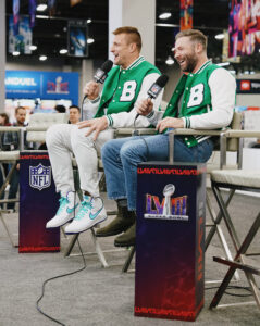 1UP Sports Marketing client Julian Edelman and Rob Gronkowski sitting in director's chairs