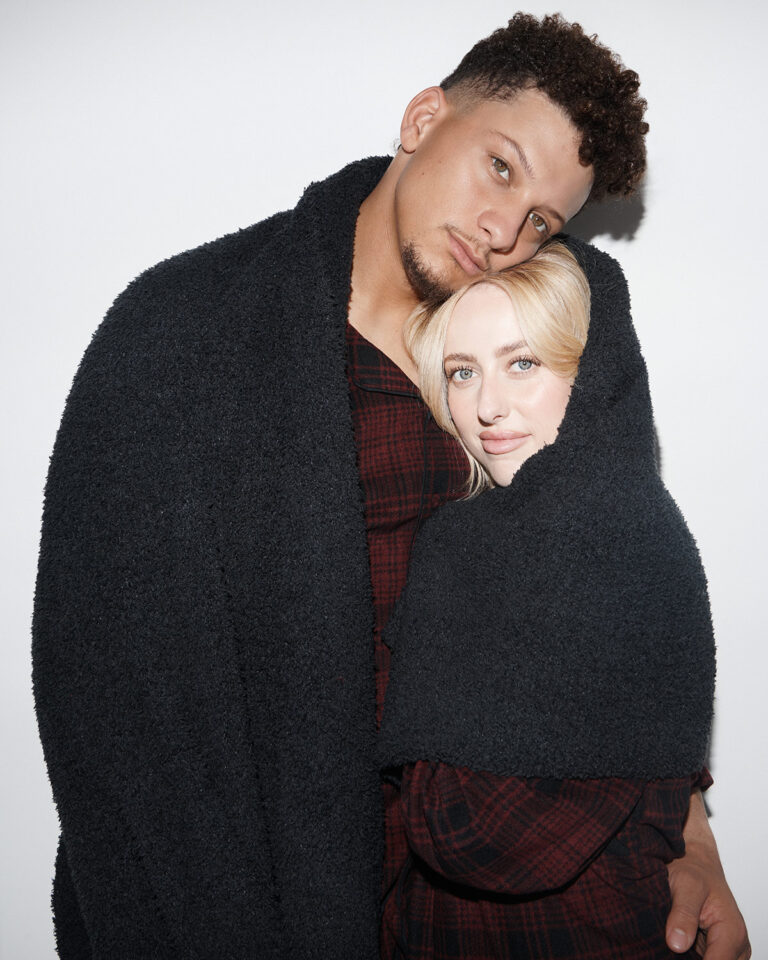 1UP Sports Marketing clients Patrick and Brittany Mahomes snuggle in a blanket by SKIMS